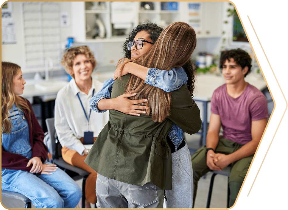 Support group with two people embracing